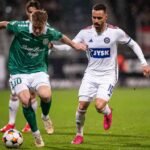 Isak Jensen and Silkeborg's Younes Bakiz battle for the ball
