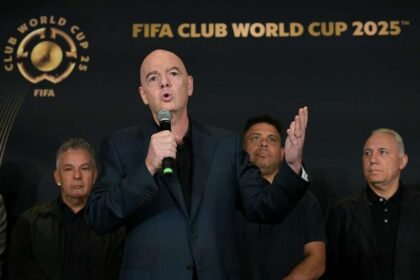 FIFA President Gianni Infantino speaks in front Roberto Baggio, Ronaldo, and Hristo Stoichkov during a press conference at the Trump Tower in New York