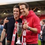 Ryan Reynolds and Rob McElhenney celebrate Wrexham's promotion to the Championship