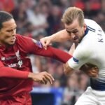 Liverpool defender virgil van Dijk competes for the ball with spurs striker Harry Kane