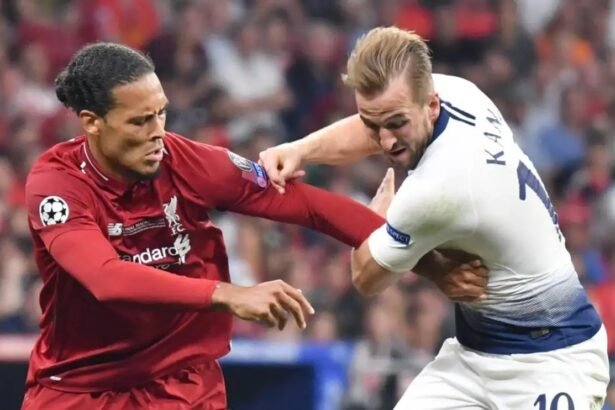 Liverpool defender virgil van Dijk competes for the ball with spurs striker Harry Kane