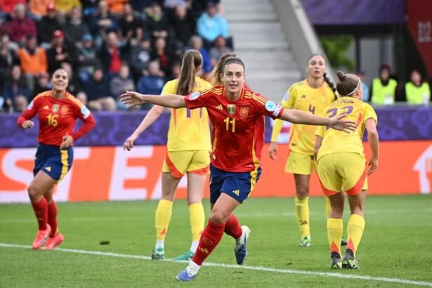 Alexia Putellas (centre) celebrates scoring for Spain