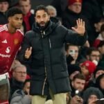 Marcus Rashford receives instructions from Ruben Amorim.