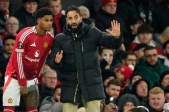 Marcus Rashford receives instructions from Ruben Amorim.