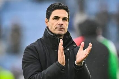 Arsenal head coach Mikel Arteta applauds supporters.