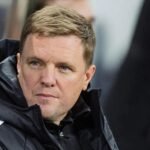 Eddie Howe looks out from a rainy dugout
