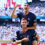 PSG players Fabian Ruiz and Achraf Hakimi celebrate during the Club World Cup semi-final against Real Madrid