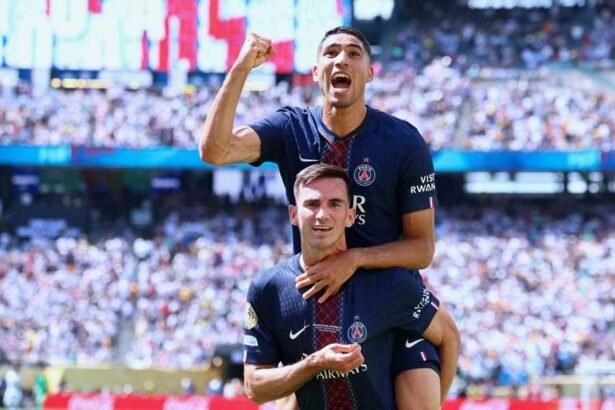 PSG players Fabian Ruiz and Achraf Hakimi celebrate during the Club World Cup semi-final against Real Madrid