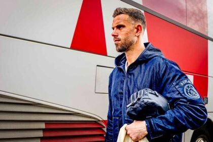 Jordan Henderson outside the Ajax team bus