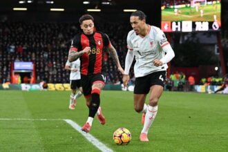 Liverpool's Virgil van Dijk battles for possession with Bournemouth's Marcus Tavernier
