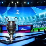 The UEFA Champions League trophy is displayed ahead of the draw