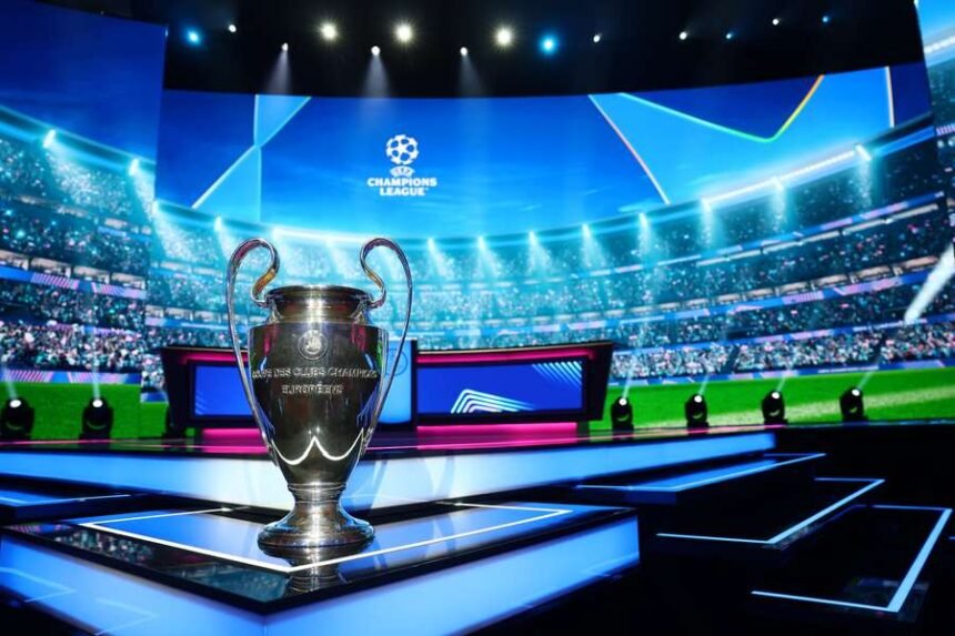 The UEFA Champions League trophy is displayed ahead of the draw