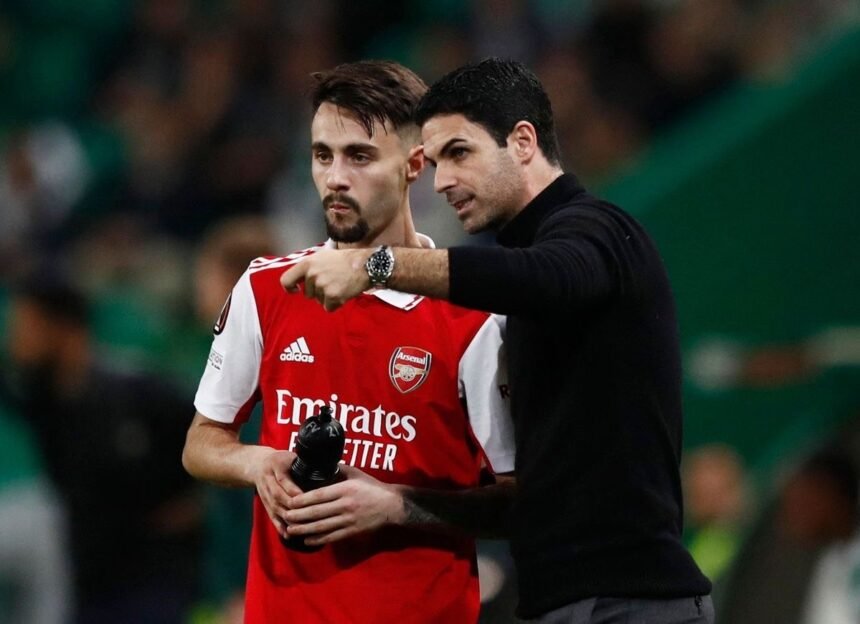 Arsenal midfielder Fabio Kiera taking instruction from Mikel Arteta during a match