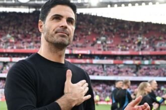 Arsenal manager Mikel Arteta applauds the supporters