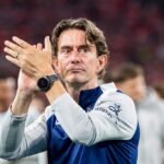 Thomas Frank applauds the Tottenham fans.