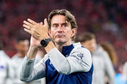 Thomas Frank applauds the Tottenham fans.