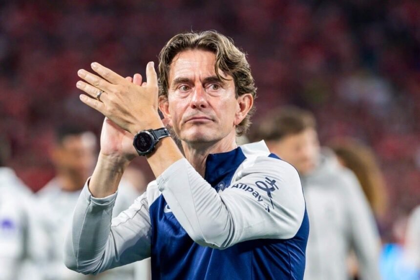 Thomas Frank applauds the Tottenham fans.