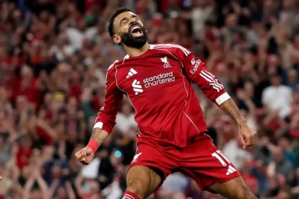 Liverpool's talisman, Mohamed Salah, has set a new Premier League record, becoming the first player in the competition’s history to score 10 goals on opening days. His remarkable feat came in a thrilling 4-2 win over Bournemouth at Anfield on Friday. A Historic Achievement Salah's strike, which came in injury time to seal the victory for Arne Slot’s side, was not just the match-winner but also a milestone that further cements his legendary status. The goal marked his 10th opening day goal, a record that no player has previously reached. Salah was already the most prolific scorer on the first day of the Premier League season, but this double-digit tally takes him into uncharted territory. Four other Premier League greats have scored eight goals on opening day, including Wayne Rooney, Alan Shearer, Jamie Vardy, and Frank Lampard. But it’s Salah who now stands alone at the top of this particular list. More Milestones for Salah In addition to his record-breaking opening day tally, the Egyptian forward also reached 187 goals in the Premier League, pulling level with Andy Cole in fourth place on the all-time top scorers list. His continued consistency in front of goal is nothing short of extraordinary, and it’s clear that he remains one of the best in the business. A Night of Emotion Friday’s match was charged with emotion, as Liverpool also paid tribute to Diogo Jota, who tragically lost his brother earlier in the week. The Kop crowd sang Jota's name throughout the match, and Salah was visibly moved as the team dedicated the win to the late Portugal international. What’s Next for Salah and Liverpool? With another goal to his name, Salah will be looking to add to his tally in Liverpool’s next match against Newcastle. The Reds have started the season with a dramatic win, and with Salah’s history-making form, they’ll be aiming to continue their push for the title.
