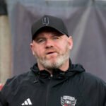 Wayne Rooney responds to Tom Brady's criticism of his work ethic during his brief stint as Birmingham City manager, calling it “very unfair” and offering his perspective on the club’s challenges.