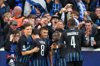 Nicolò Tresoldi celebrates with teammates after opening the scoring for Club Brugge