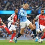 Man City's Erling Haaland scoring against Arsenal