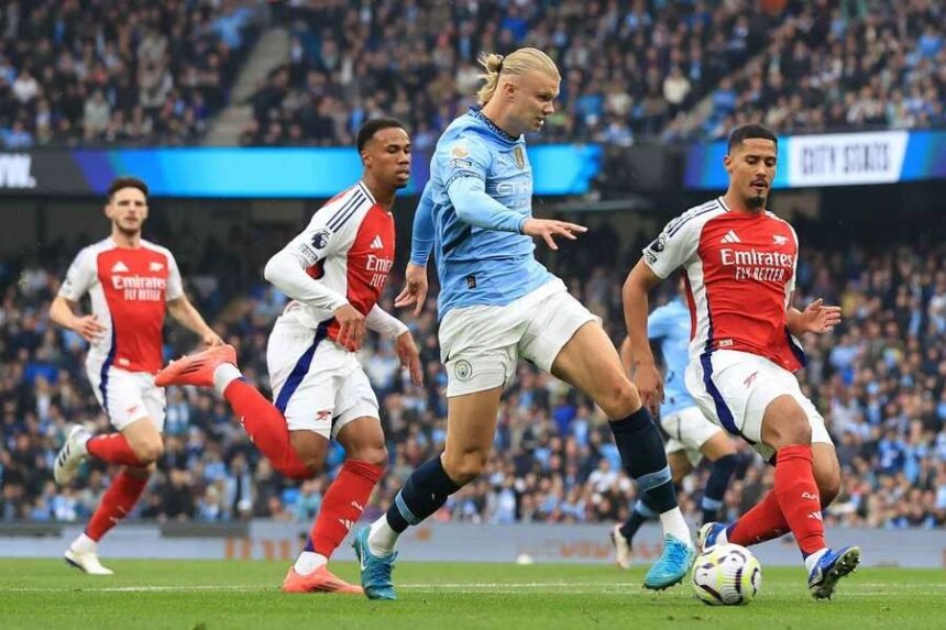 Man City's Erling Haaland scoring against Arsenal