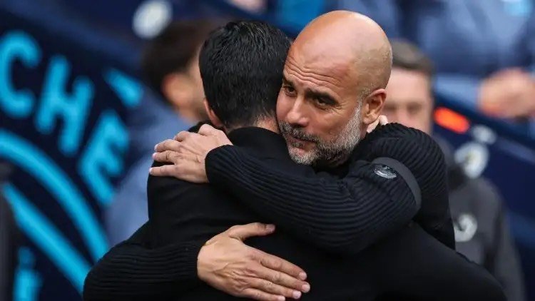 Pep Guardiola hugs Mikel Arteta ahead of a match.
