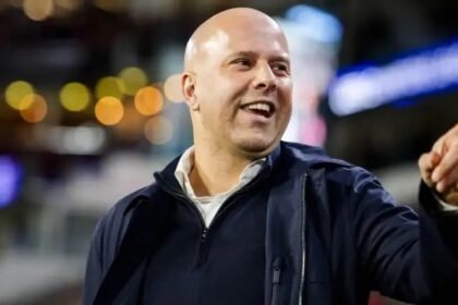 Liverpool head coach Arne Slot smiles before a match.