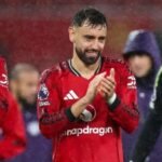 Bruno Fernandes applauds Man Utd fans.