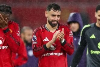 Bruno Fernandes applauds Man Utd fans.