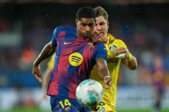 Marcus Rashford battles for the ball during a La Liga match.