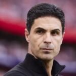 Mikel Arteta looks serious during a Premier League match.