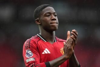 Kobbie Mainoo claps the supporters after a match.