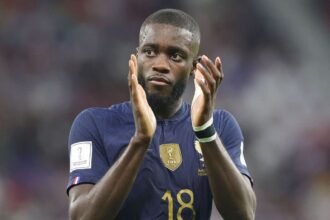 Dayot Upamecano applauds the fans after a game with France