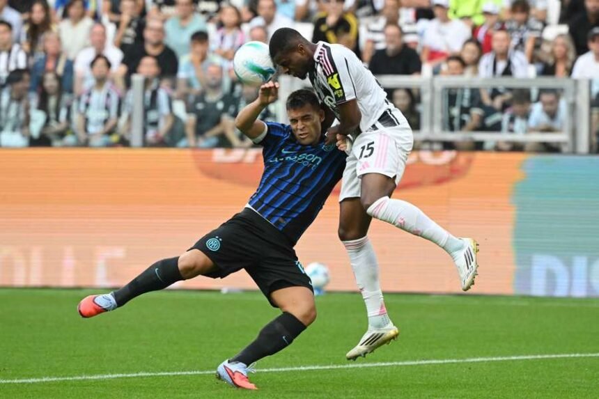 Juventus' Pierre Kalulu in action with Inter Milan's Lautaro Martinez