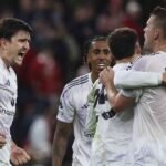 Manchester Utd players celebrate their win against Liverpool