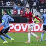 AZ's Sven Mijnans fires the deciding shot at Slovan Bratislava's goal