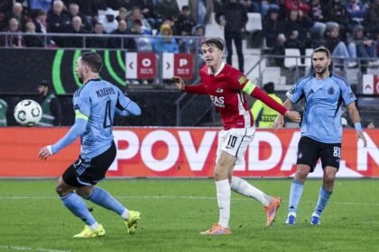 AZ's Sven Mijnans fires the deciding shot at Slovan Bratislava's goal