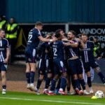 Clark Robertson celebrates with teammates after giving Dundee FC a shock lead inside the opening 18 minutes