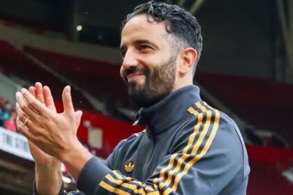 Ruben Amorim applauds the Man Utd fans.