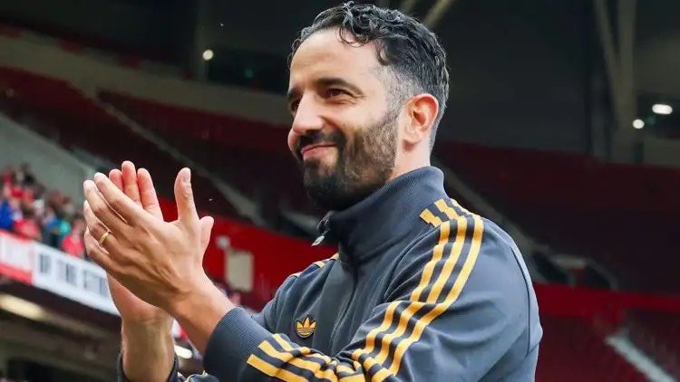 Ruben Amorim applauds the Man Utd fans.