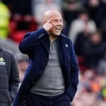 Arne Slot sends a message to his players during a Premier League match.