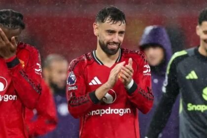 Bruno Fernandes applauds Man Utd fans.
