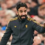 Ruben Amorim speaks to his players during a match.
