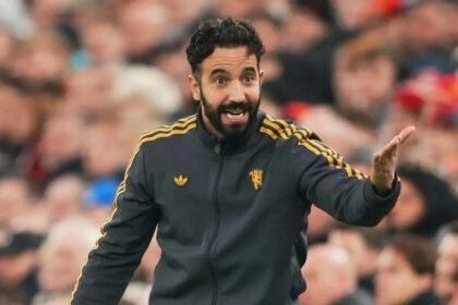 Ruben Amorim speaks to his players during a match.