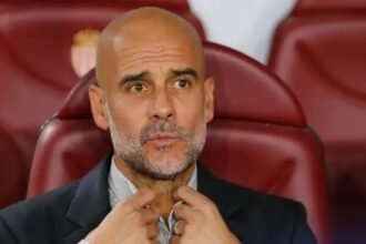 Pep Guardiola on the bench for Manchester City.